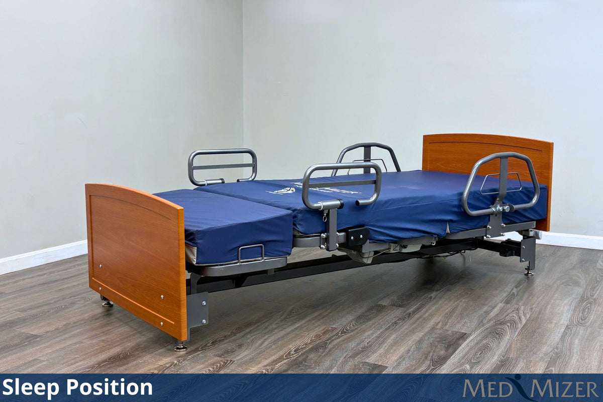 ActiveCare Fixed hospital bed at 19 inch wheelchair height with residential headboard and footboard in a home bedroom